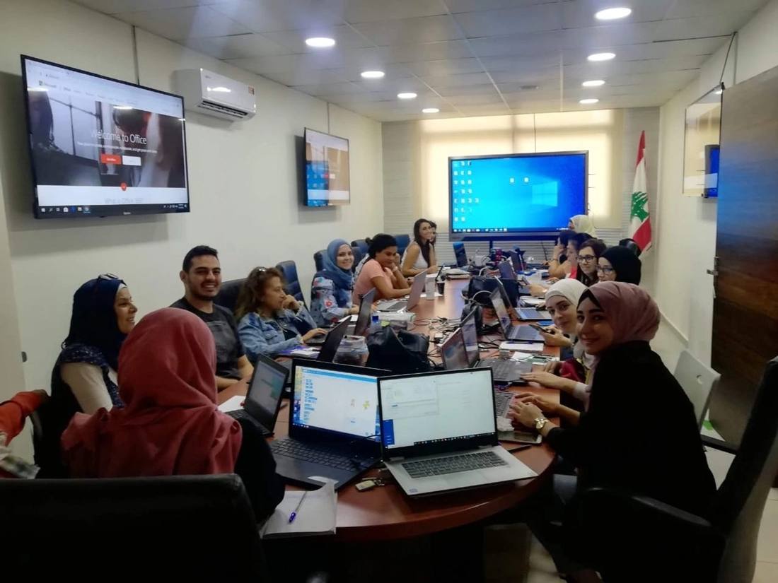 Teachers and staff planning together in the school meeting room