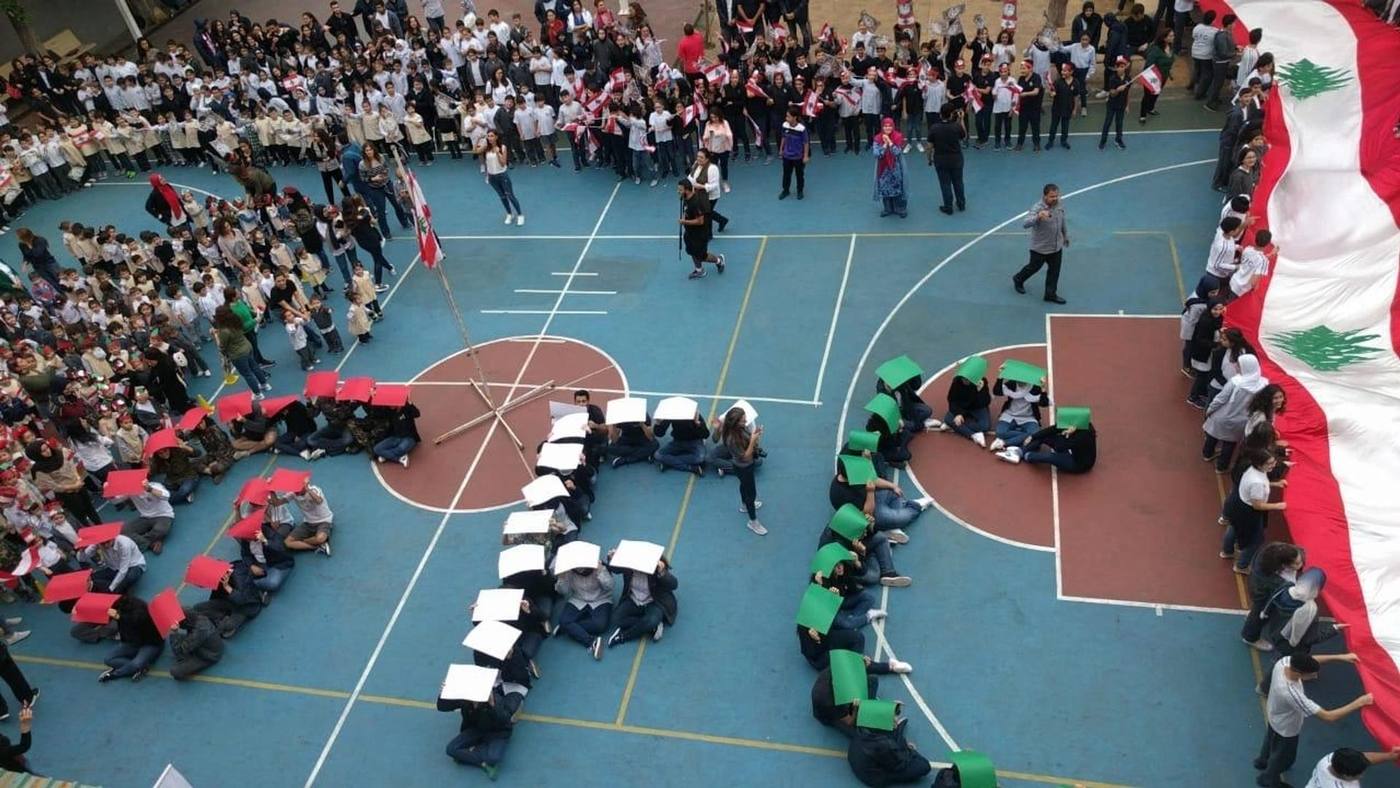 Students gathered on the school court to spell the word STEAM